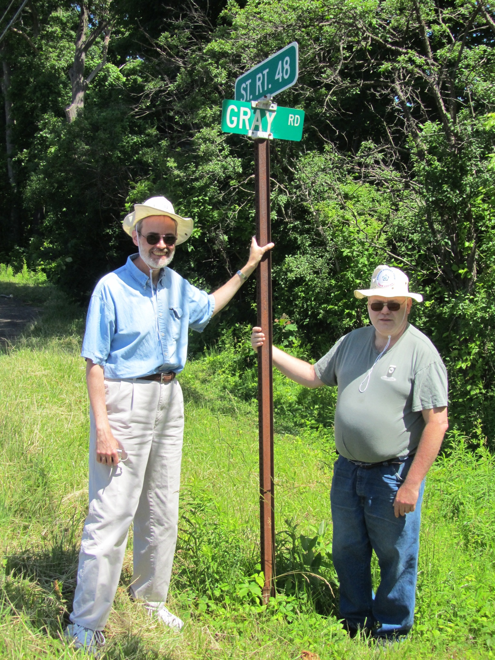 Barry and Brien Gray at the intersection of Gray Road and West River Road, Oswego, New York